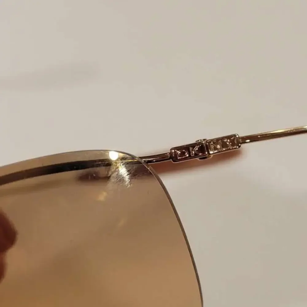 DKNY 7252S 717 Sunglasses 62x14x120 Half rim metal frame